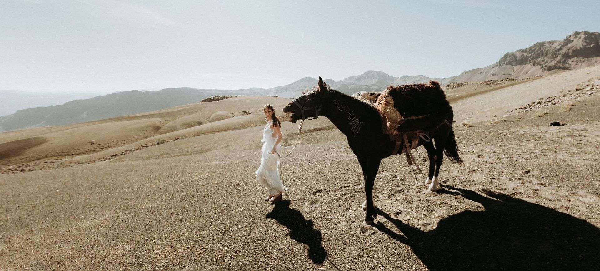 horse riding honeymoon pacakge - adventurous bride with horse in andes mountains