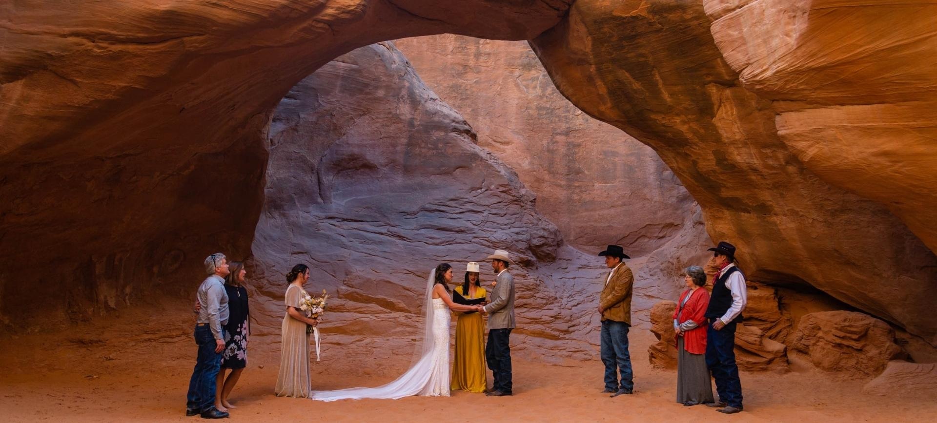 adventure elopement in Moab - wedding ceremony underneath arc