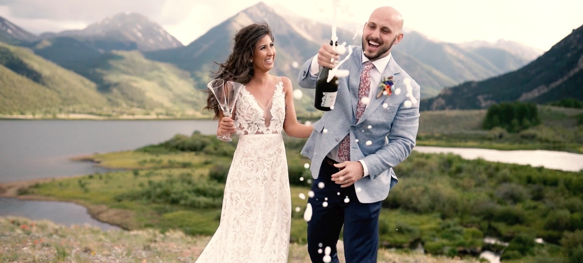 Rocky Mountains Adventure Wedding - bride & groom celebrate with champagne