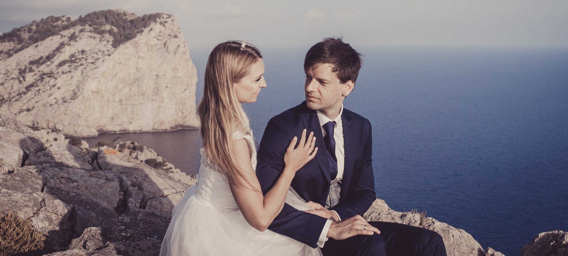 Mallorca beach elopement in formentor pollensa - bride and groom overlooking the ocean